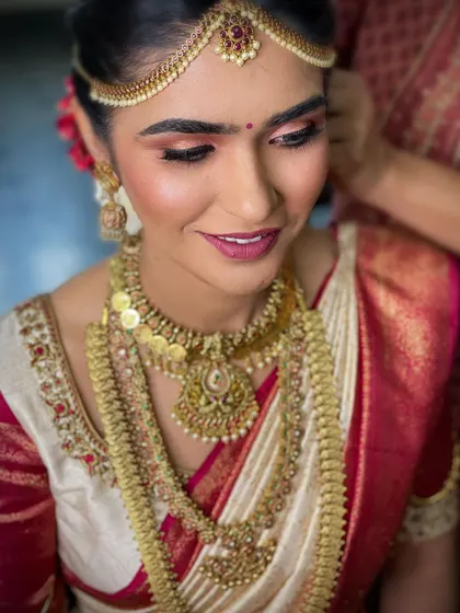 A beautiful close-up of this bride's muhurtham makeup. I used warm, rosy tones on the eyes and lips to complement her ivory and maroon Kanjeevaram saree.