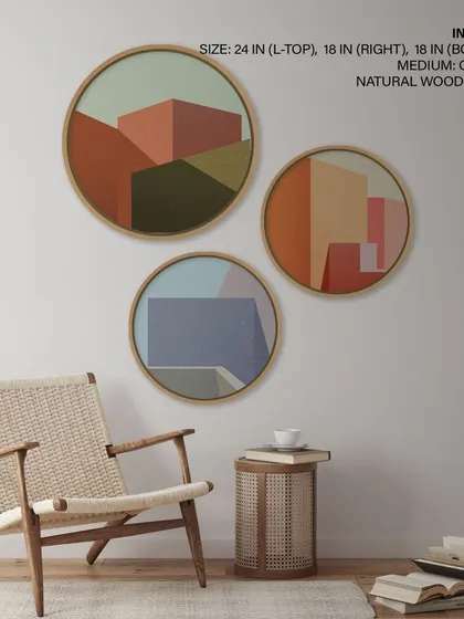 A set of three circular prints showcasing minimalist geometric buildings in an abstract style. The muted, earthy color palette and natural wood frames create a sophisticated and architectural feel.