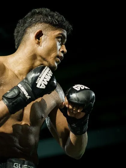 Bigger the dream, bigger the work. A candid shot of one of our pro fighters, focused and ready.