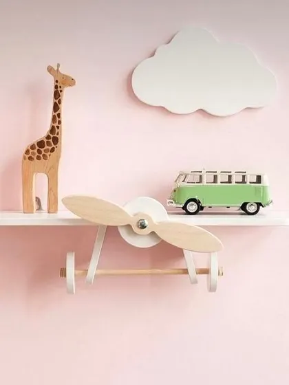 This airplane-themed wall shelf is perfect for a little pilot's room. It's a fun and functional piece, providing space for their favorite toys and books while sparking their imagination.