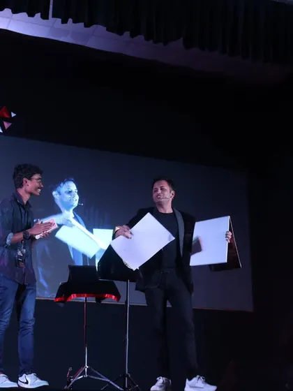Sharing the stage with a student volunteer at TEDxNitte. I love the energy and enthusiasm of college audiences, and their participation makes the show even more exciting.