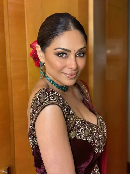 This portrait captures the intensity of the smokey eye and the flawless, soft-matte finish of the skin. It's a sophisticated look for any evening wedding event.