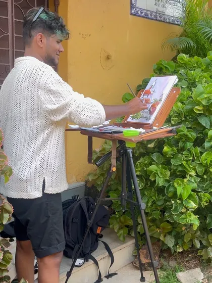 Another shot of me at my easel in Fontainhas, adding details to my watercolor piece.
