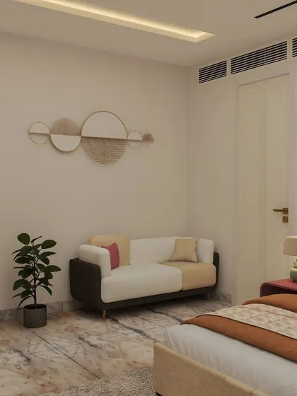 A two-toned sofa and minimalist wall art complete the clutter-free and tranquil design of this comfortable bedroom.