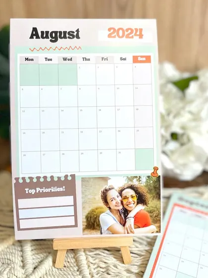 The August 2024 page of my planner calendar, displayed on a mini easel. It's a great addition to any desk, keeping you organized and motivated.