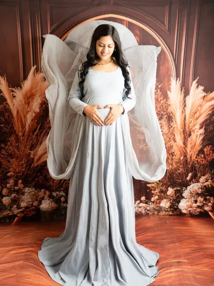 Adding a fabric toss to a simple gown can create a stunning angel-wing effect. It adds a touch of magic to this serene portrait.