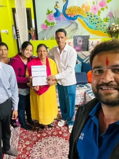 Our team captures a selfie with a happy family in their colorful living room after they signed up for a solar installation.