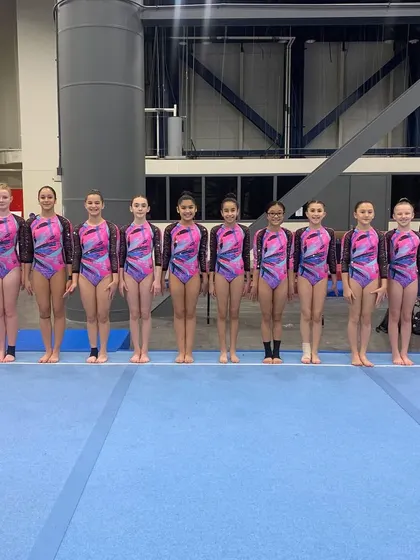 The full Xcel team lineup at The Biles Invitational, an impressive group of talented gymnasts.