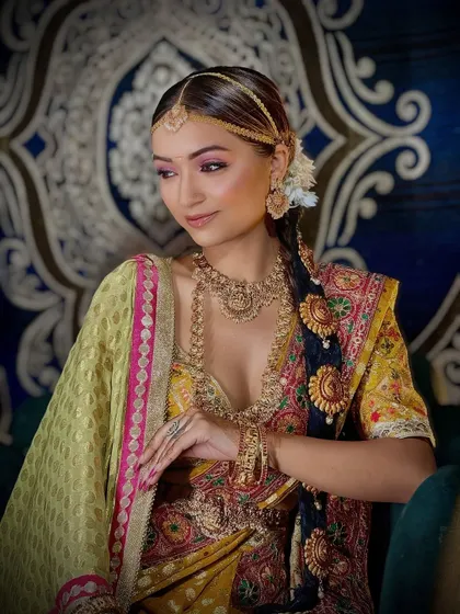 A side profile of the South Indian bridal look, highlighting the intricate hairstyle and jewelry.