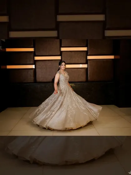 The bride twirls in her magnificent gown, a shot that captures the fairytale feel of her engagement night.