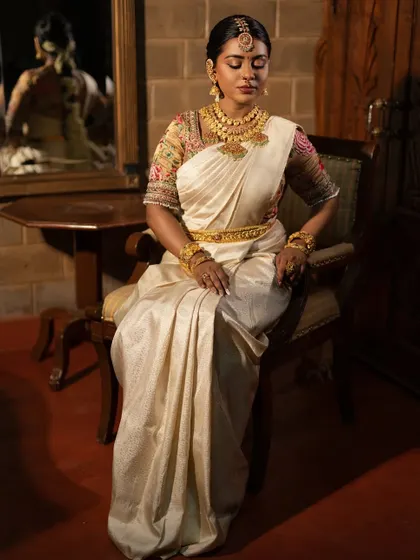 A serene and beautiful shot, with the bride's eyes closed to showcase the eye makeup.