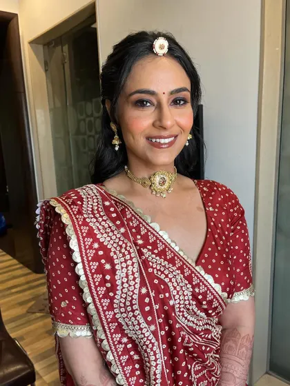 A final portrait of the bride, looking absolutely radiant. The makeup is soft, fresh, and enhances her natural beauty.
