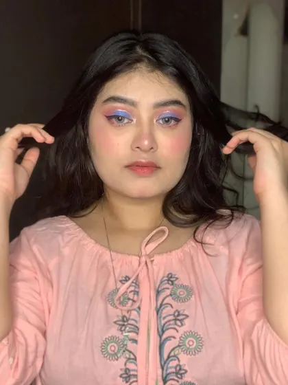 A pastel look with pink and purple eyeshadow.
