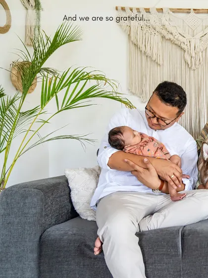 A quiet moment of connection between a father and his newborn baby. These intimate, at-home newborn sessions are all about capturing the love and wonder of this new chapter.