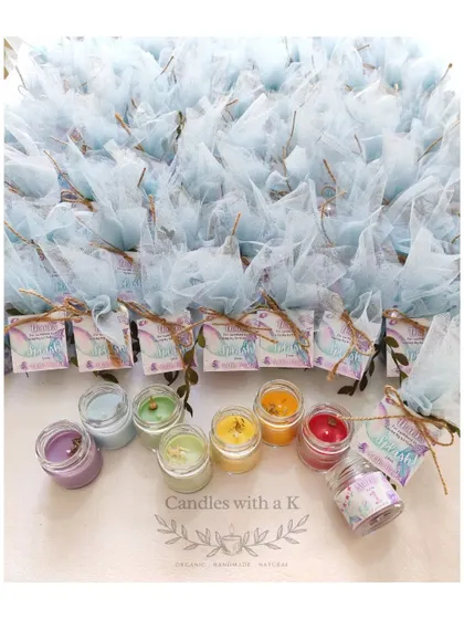 A beautiful mermaid and under-the-sea themed order of mini jar candles for a first birthday party.