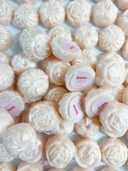 A whole batch of our flower-shaped wax melts, individually wrapped and ready to go.