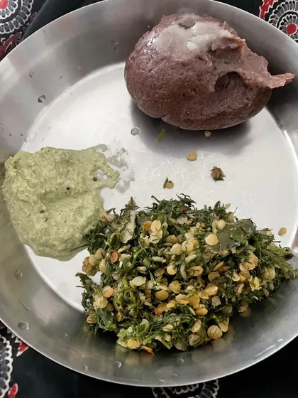 A classic client meal of Ragi Mudde (finger millet ball) with a nutritious greens and lentil stir-fry, demonstrating a high-fiber, calcium-rich traditional option.