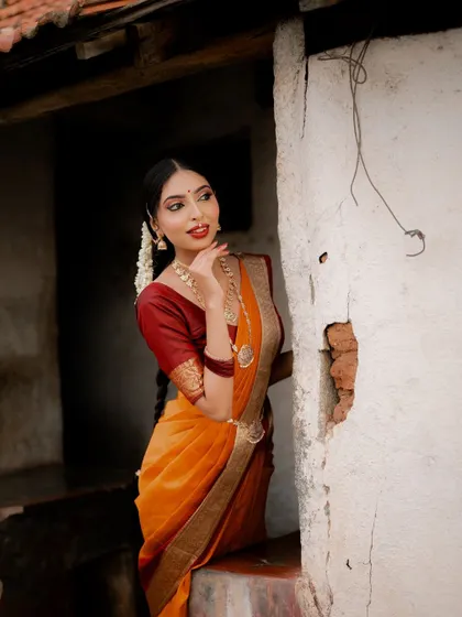 A lovely three-quarter portrait. The bride's expression is serene and confident, perfectly capturing the essence of traditional elegance.