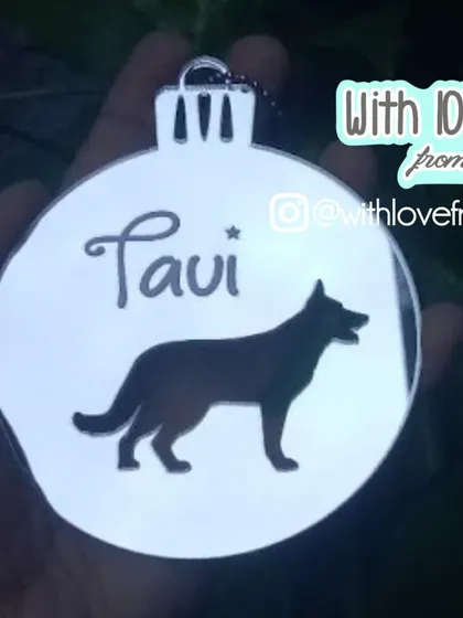 Don't forget your four-legged family members! This custom Christmas ornament features a silhouette of your dog's breed along with their name, crafted from a beautiful silver mirror acrylic.