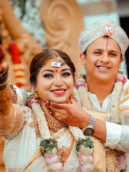 A playful and happy moment between a bride and groom during their wedding ceremony, filled with laughter and joy.