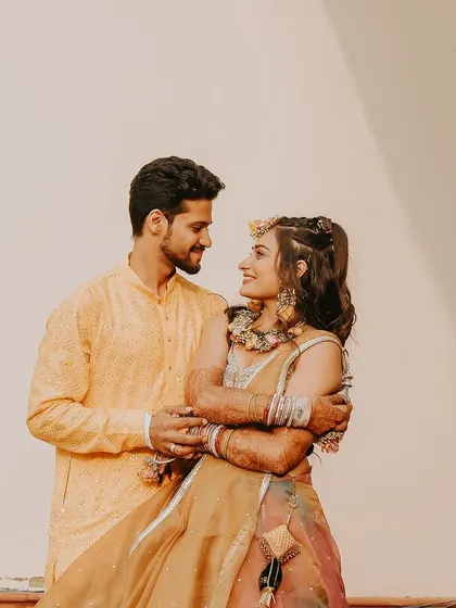 A happy, candid moment between the couple. Their natural smiles and easy embrace show the relaxed and fun atmosphere I create during our shoots.