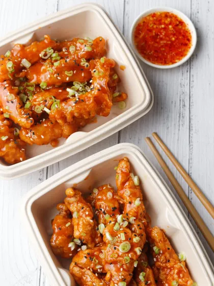 Clean and simple photography for a delivery kitchen's Korean chicken. The focus here is on making the food look appetizing and neatly packaged, giving customers confidence in the quality of their takeaway order.