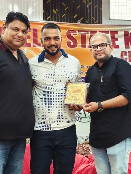 Receiving an award for my contribution as a coach at the State Kickboxing Championship. My success is my team's success.