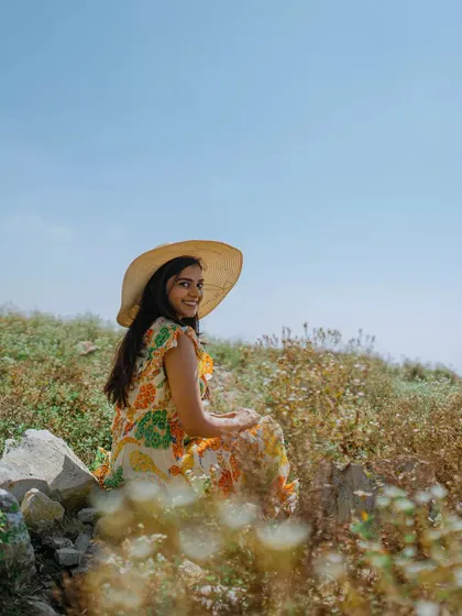 A charming portrait of the bride-to-be amidst wildflowers in Mussoorie, capturing a soft and romantic mood.