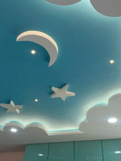 A close-up of the sky-themed false ceiling, a popular choice for kids' bedrooms. The integrated LED lighting creates a soothing ambiance, making the room a cozy haven.