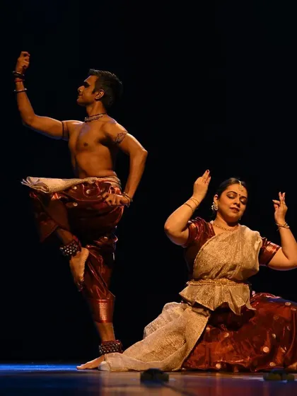 A dynamic pose from 'Raag Raagini'. The performance is a celebration of rhythm and movement, showcasing the energy of both Kathak and Bharatanatyam.