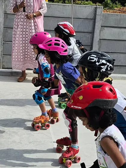Ready, set, go. A group of young girls line up at the start, ready to race, showcasing their focus and competitive spirit.