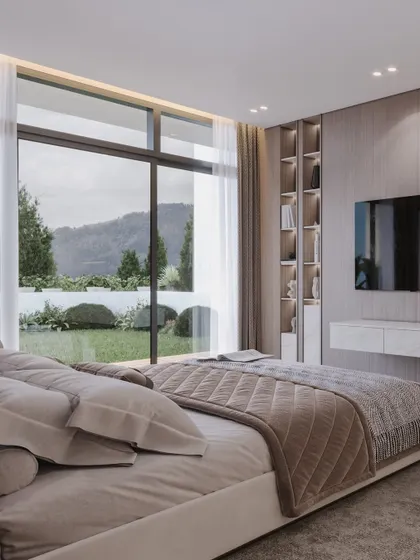 A view from the bed showcasing the stunning mountain landscape, demonstrating how the architecture frames the natural beauty outside.