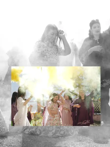 An artistic shot of the bride's friends showering her with yellow color during the Mehandi celebrations, creating a dreamy and joyful image.
