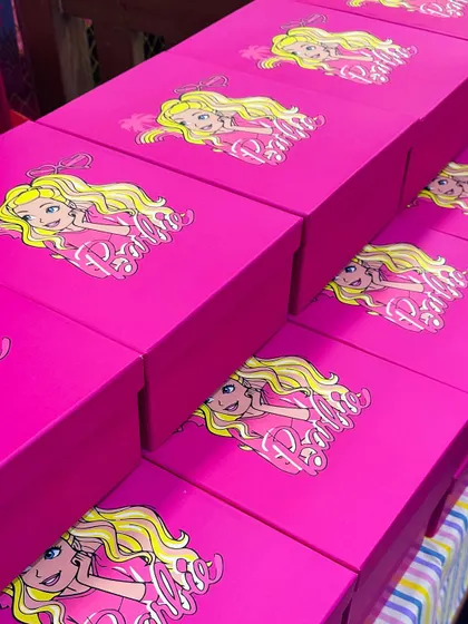The fun doesn't stop when the party ends. These custom Barbie-themed party favor boxes were filled with goodies for the guests to take home as a memory of a fantastic day.