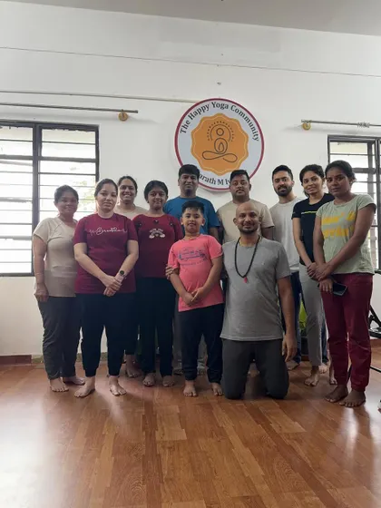 A group photo after a rejuvenating morning session. The smiles and relaxed energy show the positive impact of starting the day with yoga.