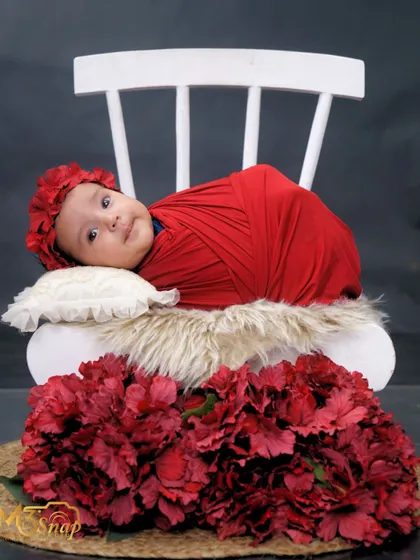 Another lovely shot of this alert baby girl. Her direct gaze creates a powerful connection with the viewer.