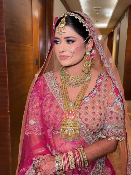 A side profile showing the intricate details of the jewelry and outfit. The makeup is kept clean and elegant to balance the overall look.