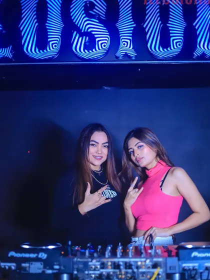 Posing with my fellow DJ for the night at Club Illusions. Teamwork makes the dream work.