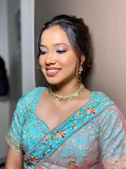 A beautiful look created for a makeup seminar. This style features a soft blend of pink and blue on the eyes, showcasing a creative and colorful approach to party makeup.