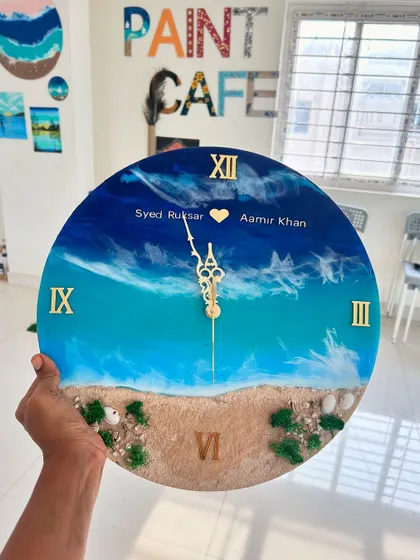 A personalized beach resin clock, complete with names, making it a perfect anniversary or wedding gift. I can customize these clocks to your specifications.