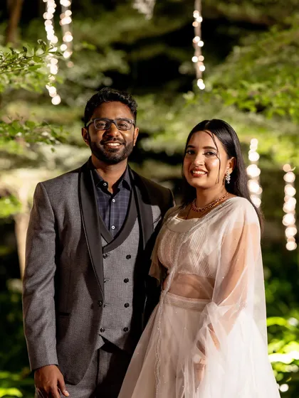 Another shot of the couple, this time under beautiful fairy lights. The makeup was designed to look romantic and glowing in the evening ambiance.
