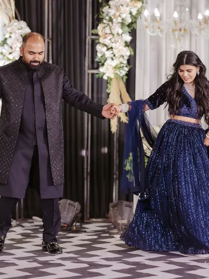 The bride is joined by the groom, but her solo moment shines, showing her leading into the couple's dance.