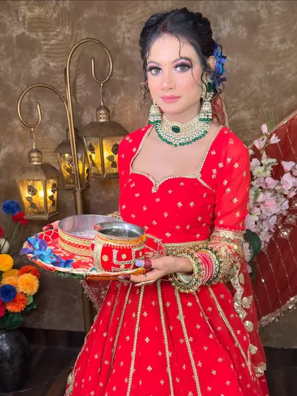 The perfect festive pose in my red lehenga. The blue flowers in the hair add a modern touch to this otherwise traditional Karwa Chauth look.