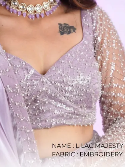 Lilac Majesty. A close-up of the beautiful embroidery and pearl work on this lilac blouse. The fabric and details are what make it a masterpiece.