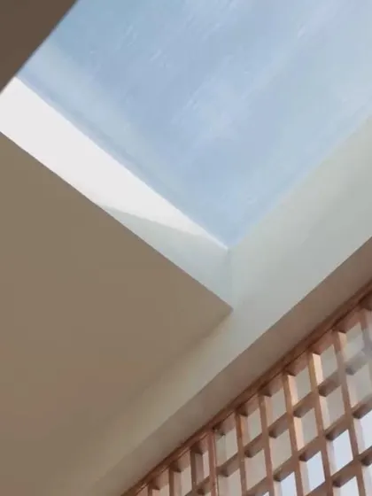 A detail of the skylight and screen wall at the House of Basho. This combination allows for natural light and ventilation while maintaining privacy, creating a perfect example of passive tropical design.