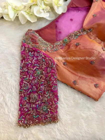 A detailed shot of the multi-colored floral embroidery on the sleeve.