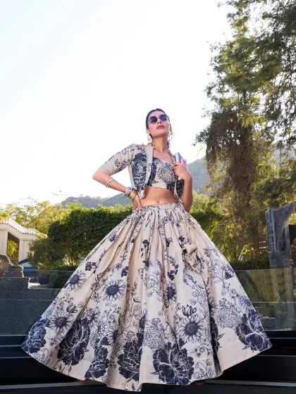 For a modern vibe with a traditional touch, I created this Tussar silk floral print lehenga. The jacket gives it a chic, Indo-Western feel, perfect for a brunch or a destination wedding event. It's elegance with a bit of an edge.