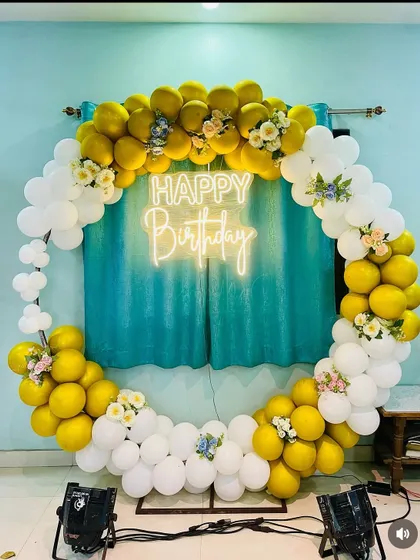 A full view of the cheerful yellow and white birthday backdrop, perfect for home parties.