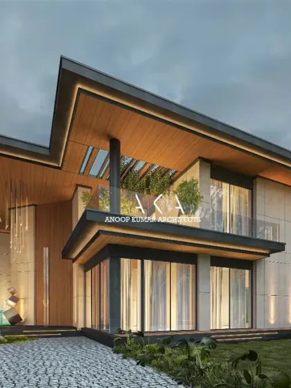 This farmhouse design incorporates natural elements with its use of light-toned stone and wood-paneled ceilings. The large windows and open balcony are designed to maximize views and natural light.