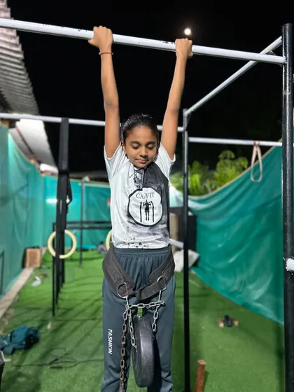 Getting ready for another set of weighted hangs. This exercise is fantastic for building the strength needed for one-arm pull-ups.